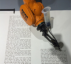 Robot writes a Torah Scroll